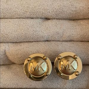 Michael Kors gold clip on earrings.